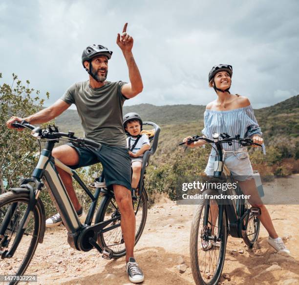 happiness family traveling with the bike - tatra mountains stock pictures, royalty-free photos & images