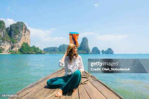 cheerful woman traveling with thai taxi boat - james bond island stock pictures, royalty-free photos & images