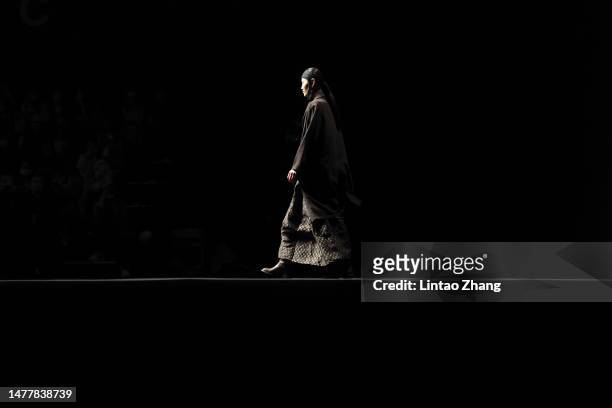 Model walks the runway at TOJI collection show by designer Yunxia Liang during the day 6 of China Fashion Week AW23 at 751 D.Park on March 29, 2023...