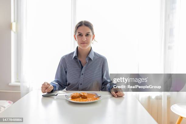 teenage girl overcomes food insecurity with gratitude and determination - hungry teen stock pictures, royalty-free photos & images