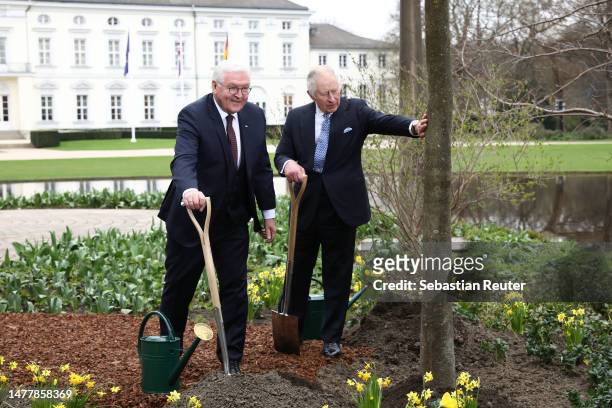 German President Frank-Walter Steinmeier and King Charles III plant a tree as part of the Queen’s Green Canopy initiative in memory of Queen...