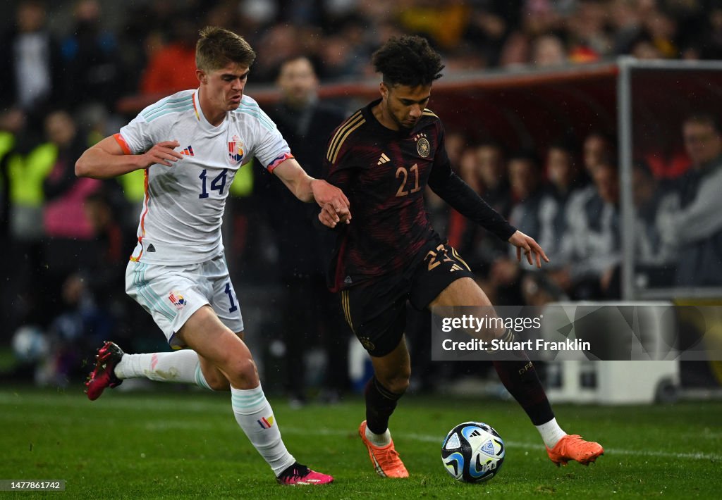 Germany Challenge Kevin Schade of Germany challenges Charles De Ketelaere of Belgium ...