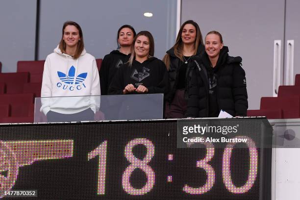 Vivianne Miedema, Jodie Taylor, Steph Catley, Giovana Queiroz Costa and Beth Mead of Arsenal look on from the stands prior to the UEFA Women's...