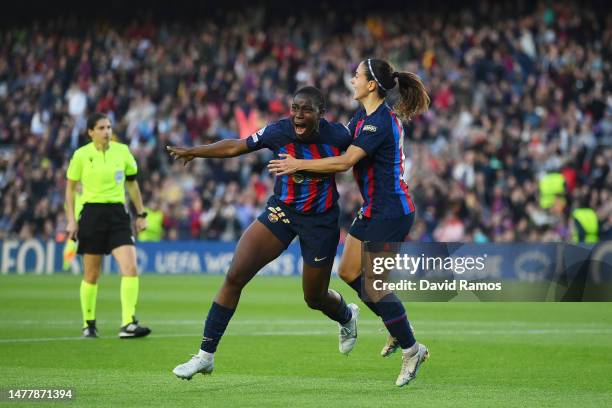 Asisat Oshoala of FC Barcelona celebrates with teammate Aitana Bonmati after scoring the team's fourth goal during the UEFA Women's Champions League...