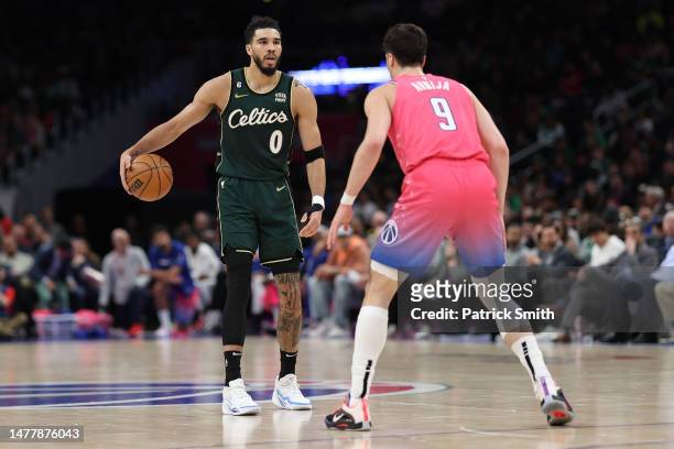 Jayson Tatum of the Boston Celtics dribbles against the Washington Wizards during the first half at Capital One Arena on March 28, 2023 in...