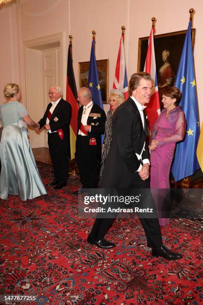 King Charles III, Camilla, Queen Consort and German President Frank-Walter Steinmeier greet Andreas Frege during a state banquet defilee at Schloss...