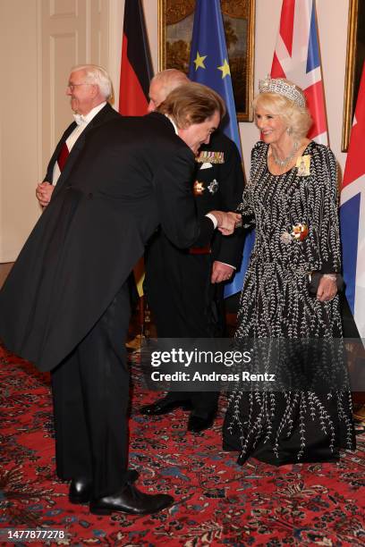 King Charles III, Camilla, Queen Consort and German President Frank-Walter Steinmeier greet Andreas Frege during a state banquet defilee at Schloss...