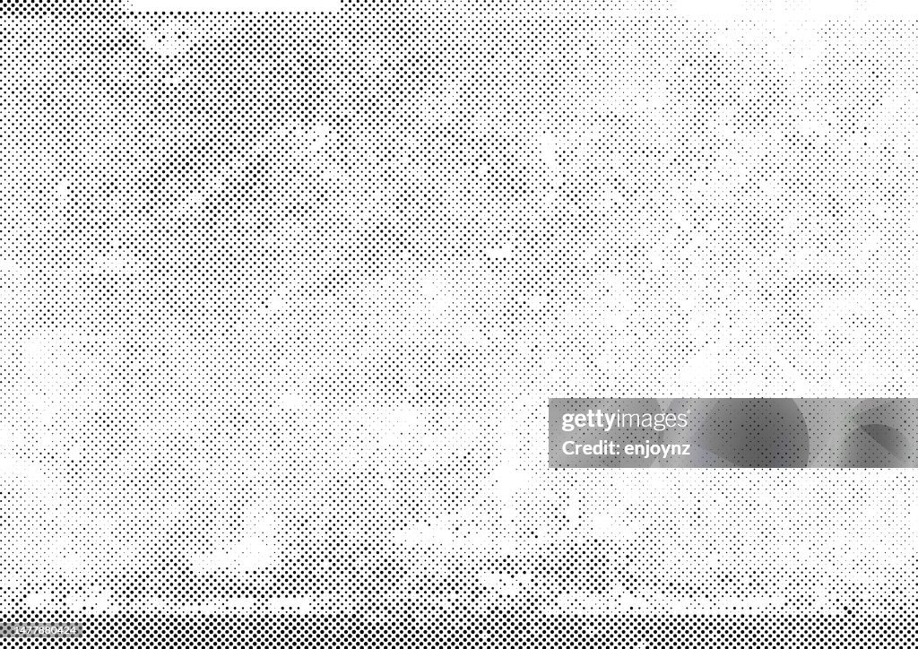 Half tone black grunge dots on white background
