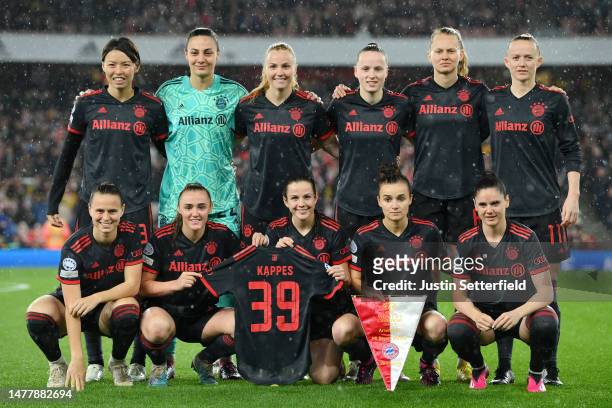 Bayern Munich players pose for a team photo whilst holding the shirt of Jana Kappes prior to the UEFA Women's Champions League quarter-final 2nd leg...