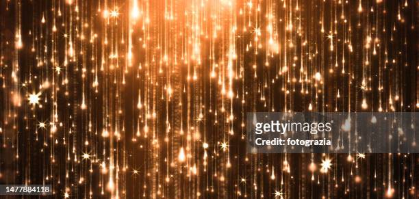 golden glitter rain - awards ceremony trophy stock pictures, royalty-free photos & images