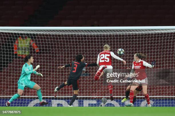 Stina Blackstenius of Arsenal scores the team's second goal whilst under pressure from Saki Kumagai of FC Bayern Munich during the UEFA Women's...