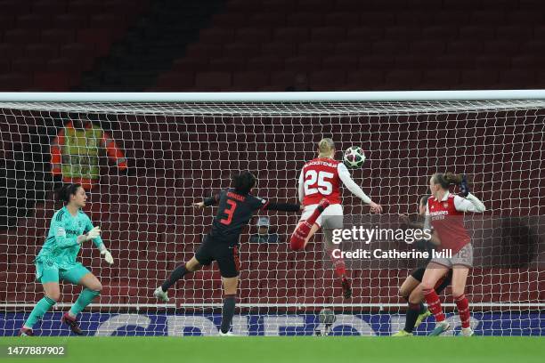 Stina Blackstenius of Arsenal scores the team's second goal whilst under pressure from Saki Kumagai of FC Bayern Munich during the UEFA Women's...