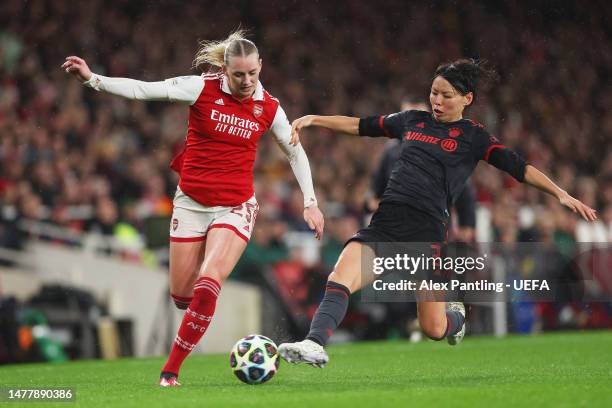 Stina Blackstenius of Arsenal and Saki Kumagai of FC Bayern Munich battle for the ball during the UEFA Women's Champions League quarter-final 2nd leg...