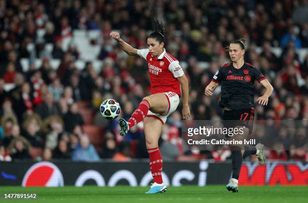 Rafaelle Souza of Arsenal controls the ball whilst under pressure from Klara Buehl of FC Bayern Munich during the UEFA Women's Champions League...