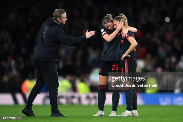 Jonas Eidevall, Manager of Arsenal, interacts with Karolina Lea Vilhjalmsdottir and Klara Buehl of FC Bayern Munich following the UEFA Women's...