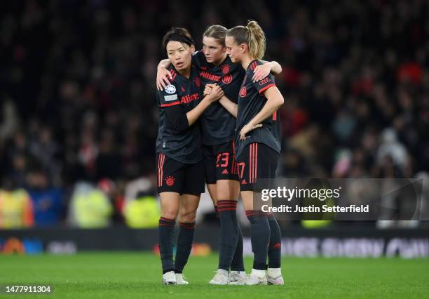 Saki Kumagai, Karolina Lea Vilhjalmsdottir and Klara Buehl of FC Bayern Munich look dejected following the UEFA Women's Champions League...