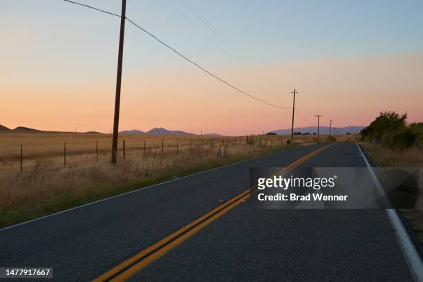 sunset over rural sonoma county road - wonderlust stock-fotos und bilder