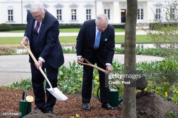 German President Frank-Walter Steinmeier and King Charles III plant a tree as part of the Queen’s Green Canopy initiative in memory of Queen...