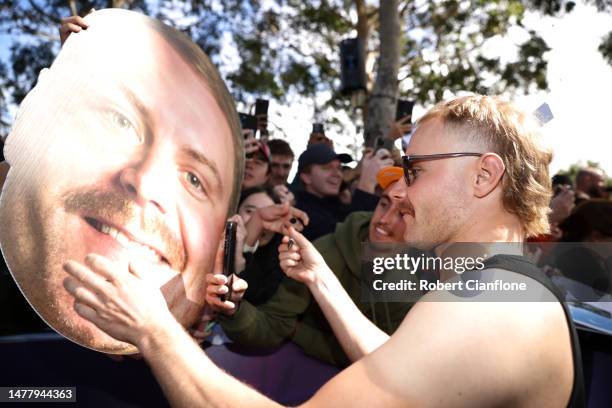 Valtteri Bottas of Finland and Alfa Romeo F1 greets fans at the Melbourne Walk during previews ahead of the F1 Grand Prix of Australia at Albert Park...