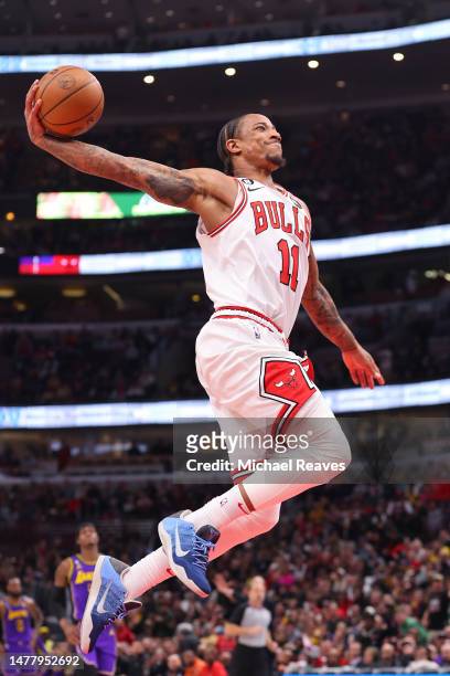 DeMar DeRozan of the Chicago Bulls dunks against the Los Angeles Lakers during the first half at United Center on March 29, 2023 in Chicago,...