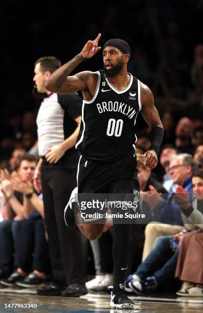 Royce O'Neale of the Brooklyn Nets reacts after making a three-pointer during the game against the Houston Rockets at Barclays Center on March 29,...