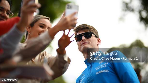 Logan Sargeant of United States and Williams greets fans on the Melbourne Walk during previews ahead of the F1 Grand Prix of Australia at Albert Park...