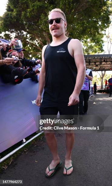 Valtteri Bottas of Finland and Alfa Romeo F1 greets fans at the Melbourne Walk during previews ahead of the F1 Grand Prix of Australia at Albert Park...