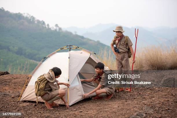 boy scout students attending a scout camp having - girl scout camp stock pictures, royalty-free photos & images