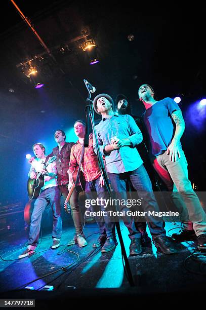 Brian Fallon, Joe Ginsberg, Dave Hause, Chuck Ragan, Jon Gaunt and Dan Adriano of American rock band The Gaslight Anthem performing on stage during...