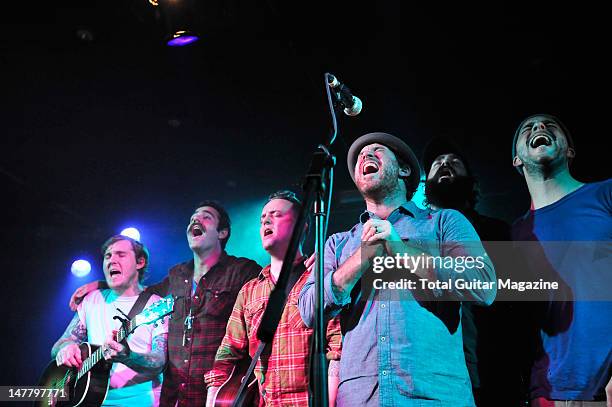 Brian Fallon, Joe Ginsberg, Dave Hause, Chuck Ragan, Jon Gaunt and Dan Adriano of American rock band The Gaslight Anthem performing on stage during...