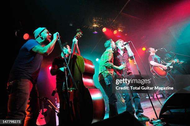 Dan Adriano, Joe Ginsberg, Dave Hause, Brian Fallon, Chuck Ragan and Jon Gaunt performing on stage during The Revival Tour, October 17 Portsmouth...