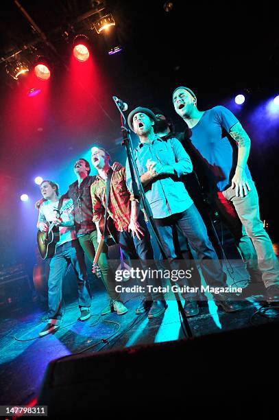 Brian Fallon, Joe Ginsberg, Dave Hause, Chuck Ragan, Jon Gaunt and Dan Adriano of American rock band The Gaslight Anthem performing on stage during...