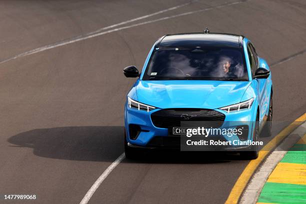 Daniel Ricciardo of Australia and Oracle Red Bull Racing drives a Ford Mustang on track during previews ahead of the F1 Grand Prix of Australia at...