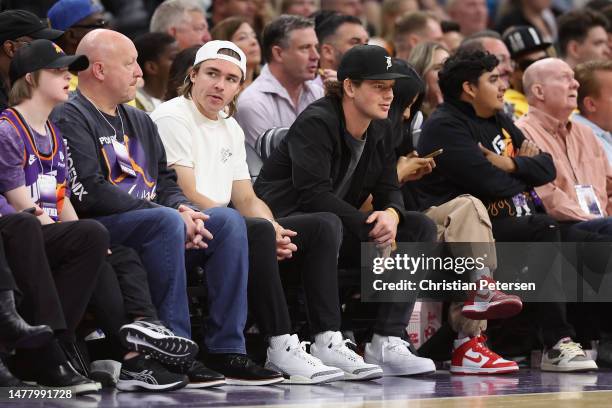 Athletes, Clayton Keller and Barrett Hayton of the Arizona Coyotes attend the NBA game between the Phoenix Suns and the Minnesota Timberwolves at...