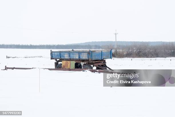 abandoned tractor trailer in a snowy field at a farm - kazan stock pictures, royalty-free photos & images