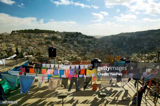 clothes hanging on roof top - jerusalem city stock pictures, royalty-free photos & images