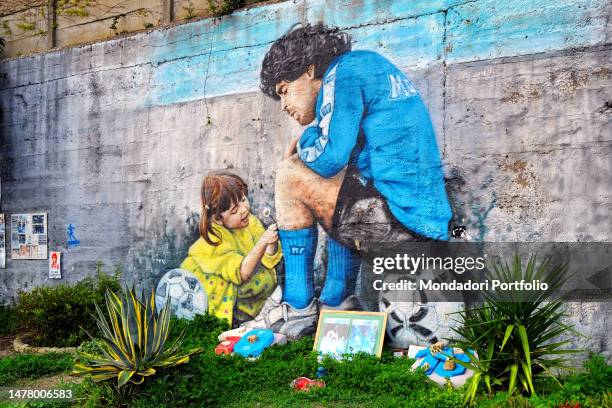 Mural depicting Diego Armando Maradona and is daughter Dalma is seen outside former SSC Napoli sport complex in Soccavo district. Naples , 25 March...