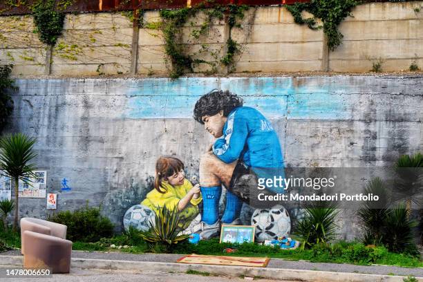 Mural depicting Diego Armando Maradona and is daughter Dalma is seen outside former SSC Napoli sport complex in Soccavo district. Naples , 25 March...
