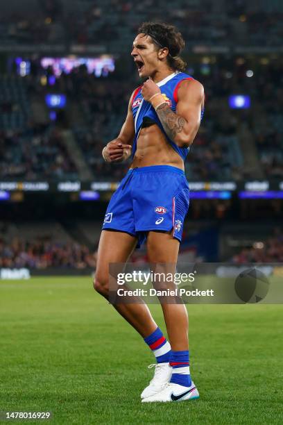 Jamarra Ugle-Hagan of the Bulldogs points to his skin as he celebrates kicking a goal during the round three AFL match between Western Bulldogs and...