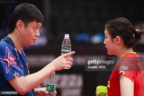 Chen Meng talks with her coach in the Women's singles semi-final match against Qian Tianyi during the Chinese Team Trials for 2023 Durban World Table...