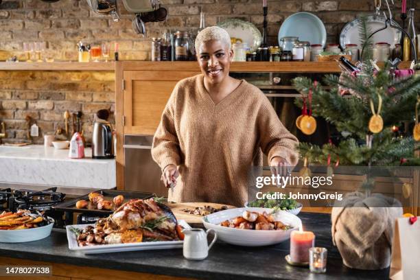 portrait of female cook and freshly made christmas dinner - woman chef stock pictures, royalty-free photos & images