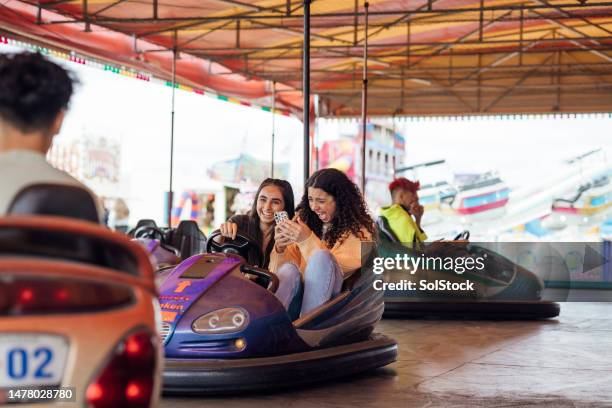 teenagers at a funfair - amusement park ride stock pictures, royalty-free photos & images