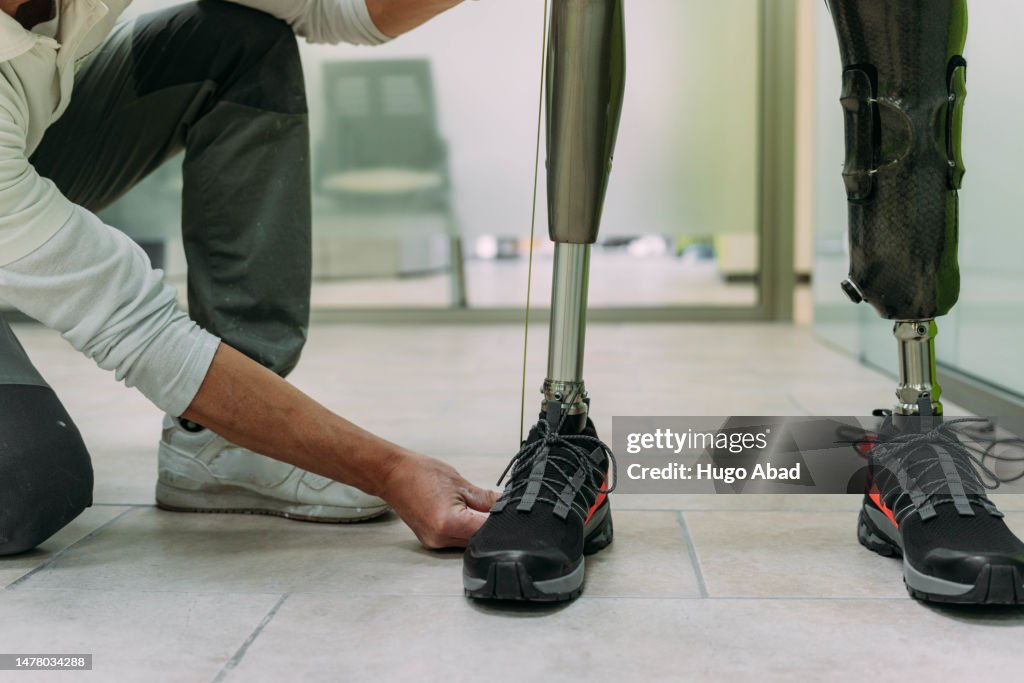 An assistant with a handicapped person.