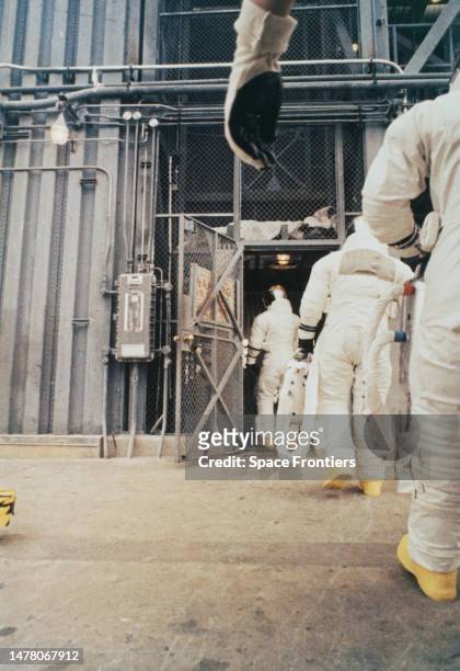 American NASA astronaut James McDivitt leads American NASA astronaut Rusty Schweickart, and American NASA astronaut David Scott, who is only...