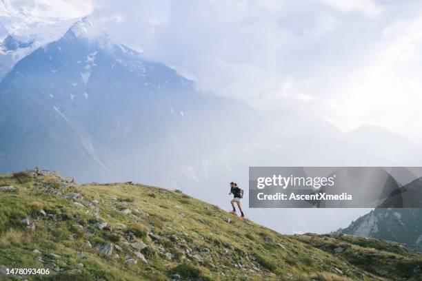 aerial view of trail runners ascending mountain ridge - bound in high heels stock pictures, royalty-free photos & images