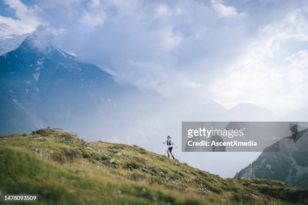 aerial view of trail runners ascending mountain ridge - bound in high heels stock pictures, royalty-free photos & images