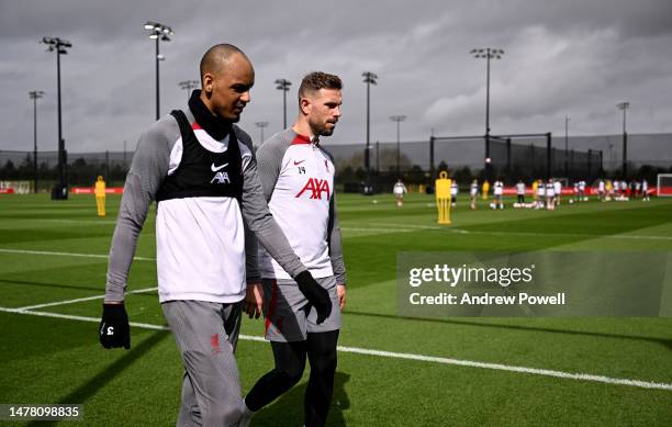 Fabinho and Jordan Henderson captain of Liverpool during a training session at AXA Training Centre on March 30, 2023 in Kirkby, England.