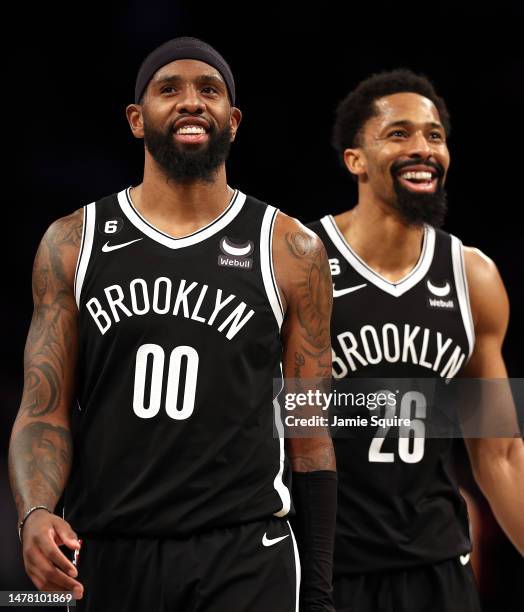 Royce O'Neale and Spencer Dinwiddie of the Brooklyn Nets smile as the seconds tick off the clock as the Nets defeat the Houston Rockets to win the...