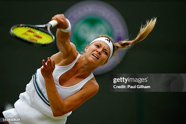 Maria Kirilenko of Russia in action during her Ladies' Singles quarterfinal match against Agnieszka Radwanska of Poland on day eight of the Wimbledon...