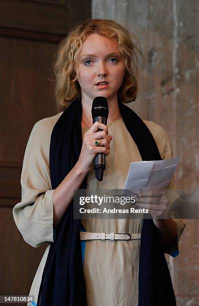 Lily Cole reads a poem during a debate at Liberatum Berlin hosted by Grey Goose vodka at Soho House Apartments Berlin. The two day summit brings...